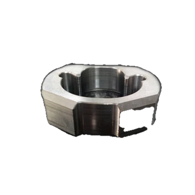 Hexagonal machined housing with a bored, stepped internal diameter.