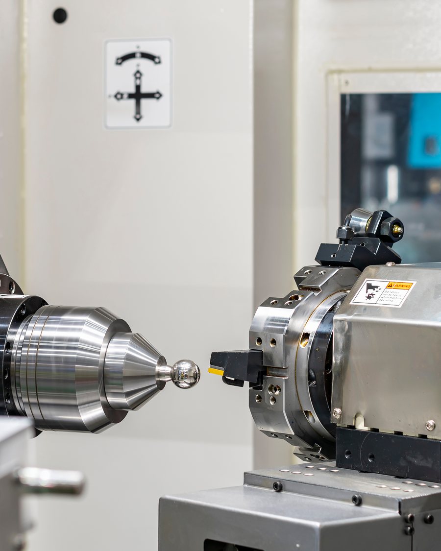 A rotary axis and tailstock on a CNC turning centre.
