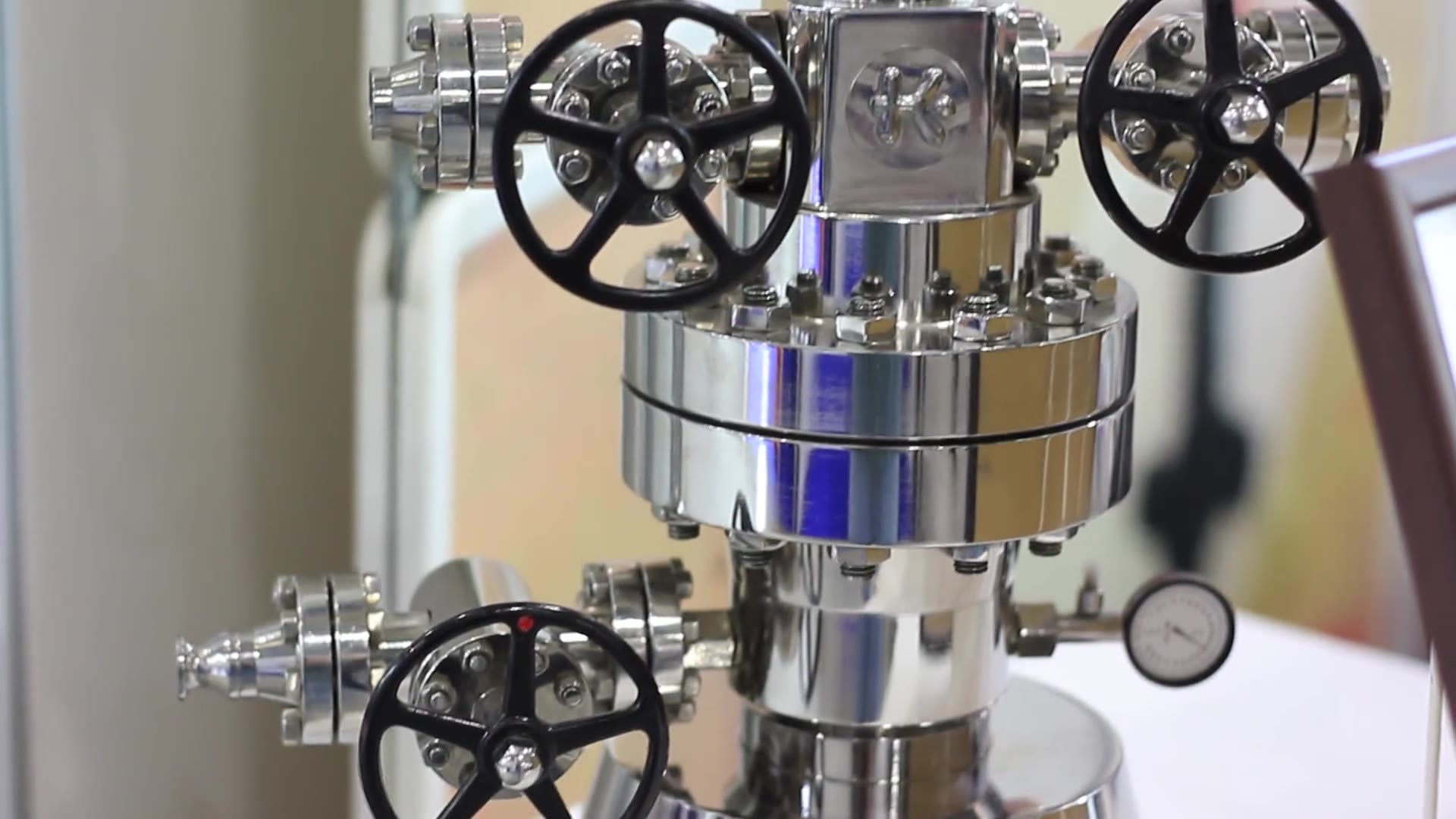 Stainless steel gate valves and fittings on a test rig.